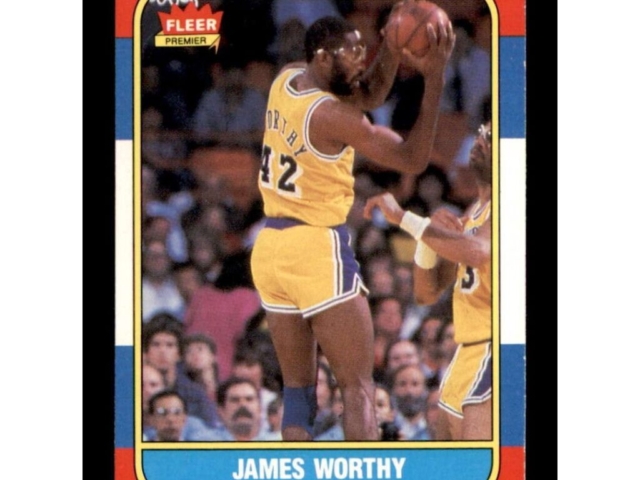 1986 Fleer James Worthy # 42 Lakers basketball card – Near Mint condition with iconic green/yellow Fleer border